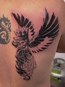 winged skull dot work tattoo tauranga